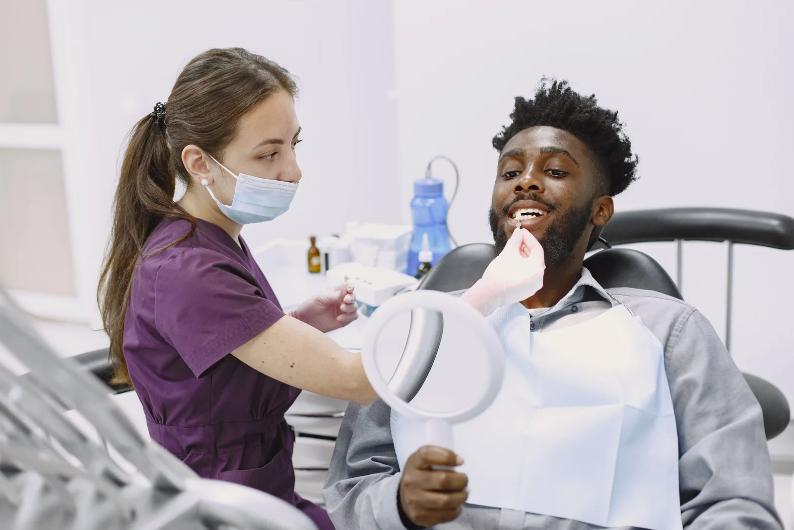 Crown shade checked with a hand mirror, shown while covering Sedation Options in Toronto
