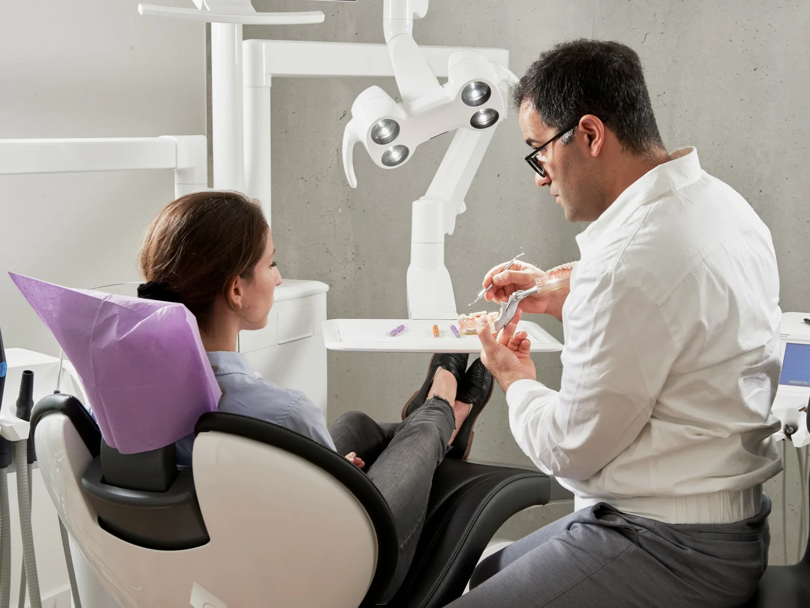 Implant consultation with a patient, at the implant practice in Toronto