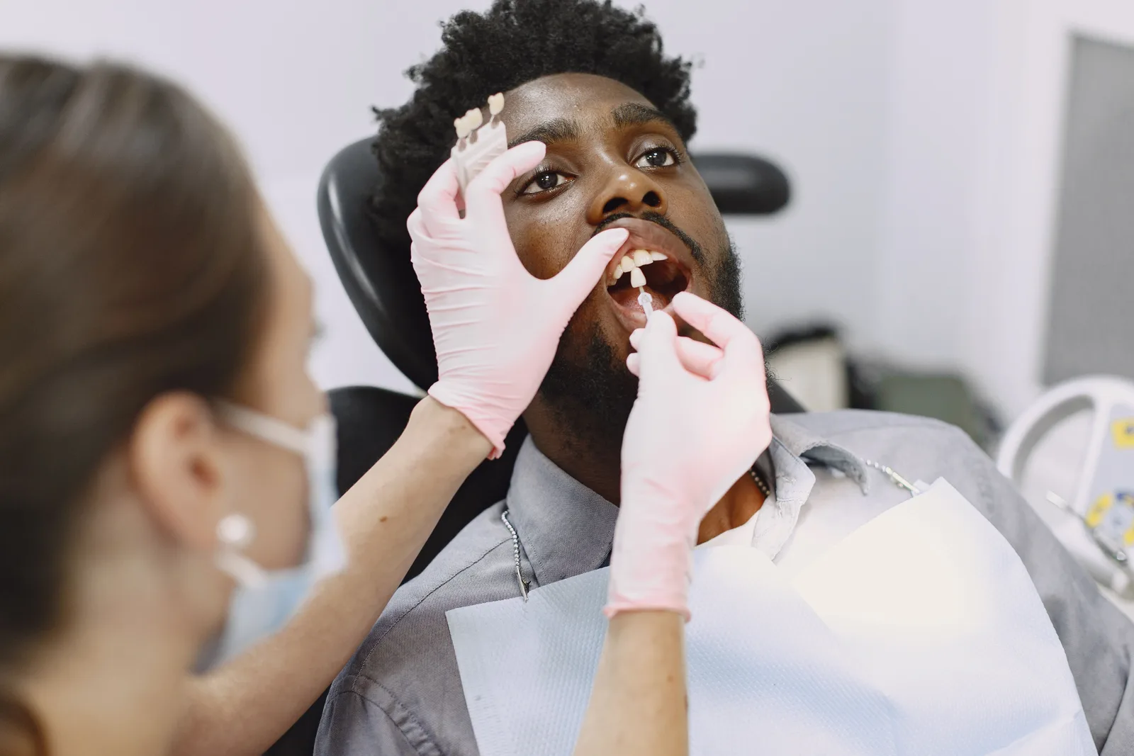 Matching an implant crown shade to the natural teeth, referred to in the Sedation Options section for Toronto