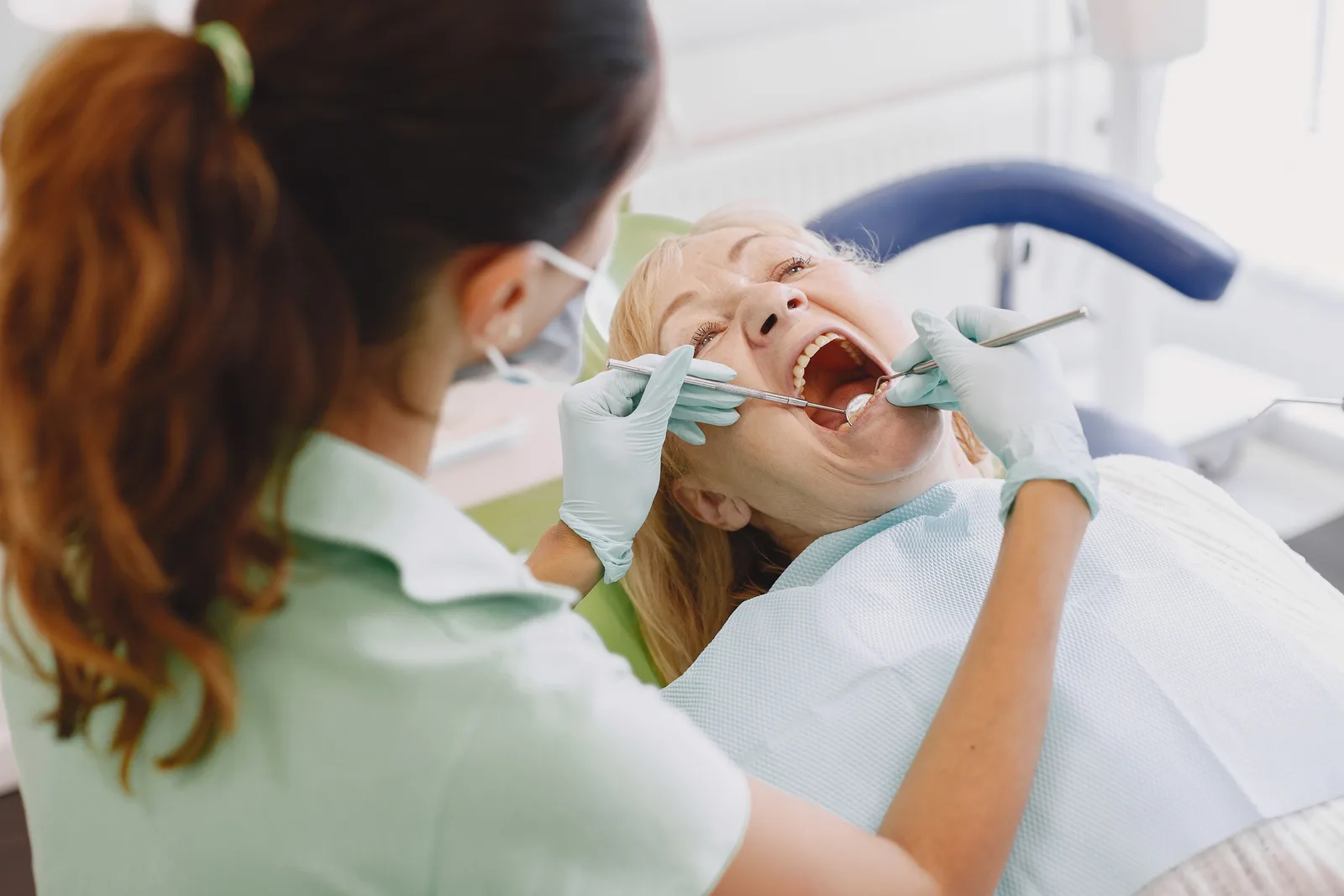 Oral exam before implant planning, alongside the Implant Consultation explanation in Toronto
