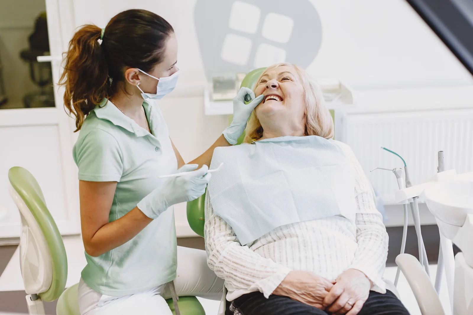 Patient at ease during a dental checkup, shown while covering Single Implant Cost in Toronto